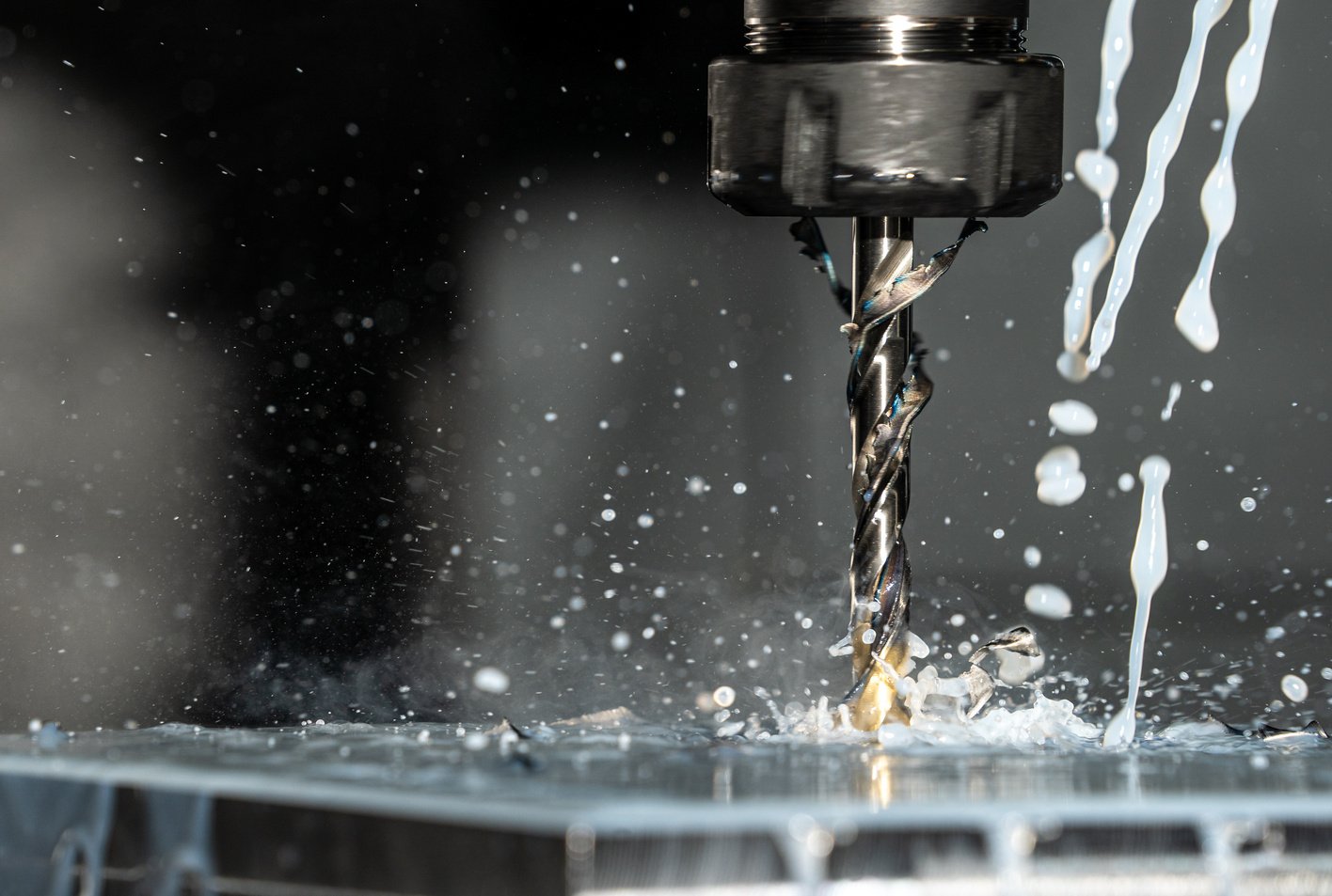 Close Up Phot of a CNC Milling Machine with Metalworking Fluid